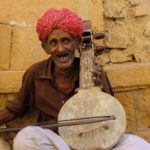 Musician playing the Kamaicha, a traditional string based instrument from Rajasthan-