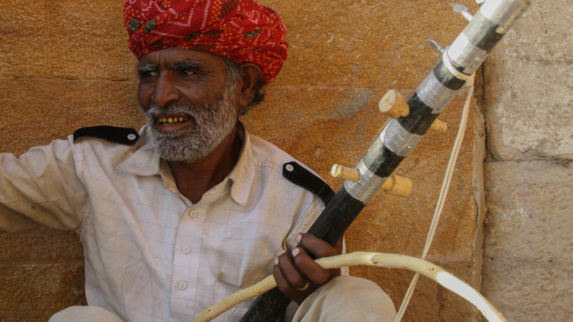Musician playing the Ravanatthi instrument from Rajasthan